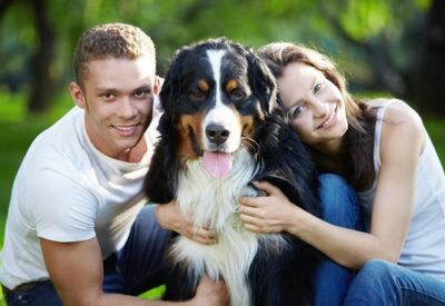 couple with a healthy dog